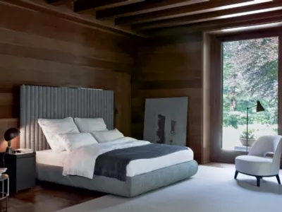 Letto in tessuto con testiera formata da cilindri imbottiti Biarritz Slim di Flexform