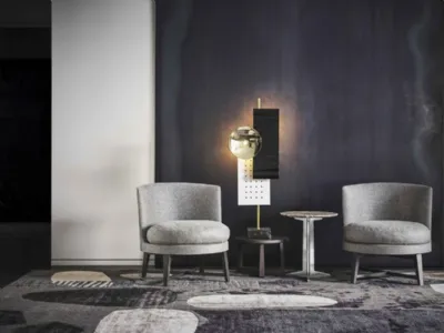 Poltroncina tonda in tessuto imbottito con gambe in metallo satinato Feel Good di Flexform