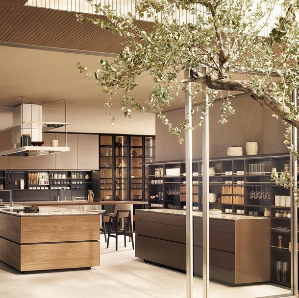 Cucina Design in Noce Canaletto e Marmo Calacatta con isola Artex di Poliform